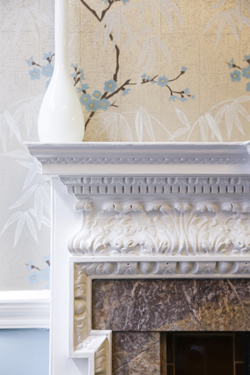 Fireplace corner with wallpaper